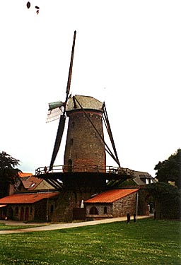 this windmill is part of the town wall
